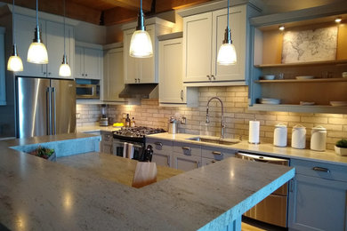 Mid-sized minimalist l-shaped light wood floor, beige floor and wood ceiling eat-in kitchen photo in Milwaukee with a single-bowl sink, recessed-panel cabinets, gray cabinets, marble countertops, white backsplash, ceramic backsplash, stainless steel appliances, an island and white countertops