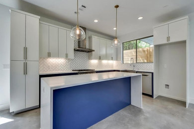 Example of a mid-sized minimalist l-shaped concrete floor and gray floor open concept kitchen design in Austin with flat-panel cabinets, white cabinets, marble countertops, multicolored backsplash, porcelain backsplash, stainless steel appliances, an island and white countertops