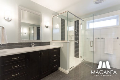 Bathroom - large traditional master black and white tile and ceramic tile cement tile floor and gray floor bathroom idea in Other with shaker cabinets, brown cabinets, green walls, an undermount sink, granite countertops and a hinged shower door