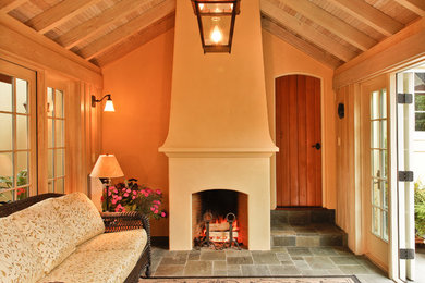 Inspiration for a mid-sized timeless slate floor and gray floor sunroom remodel in Seattle with a standard fireplace