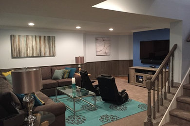 Example of a huge transitional underground carpeted basement design in Philadelphia with blue walls
