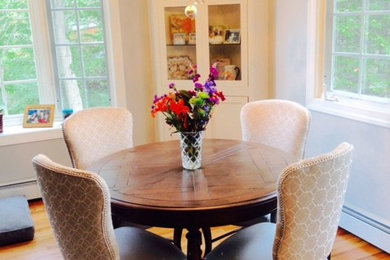 Kitchen/dining room combo - mid-sized transitional medium tone wood floor and brown floor kitchen/dining room combo idea in New York with white walls and no fireplace