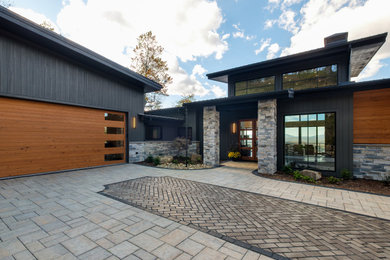 Inspiration for a contemporary two-car garage remodel in Other