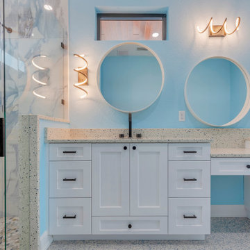 Master Bathroom With Bathtub and Attached Shower, Wall Mirror and Wall Lamps