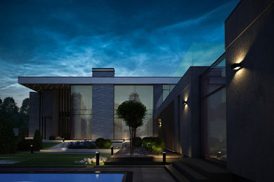 Réalisation d'une grande façade de maison grise design à un étage avec un revêtement mixte et un toit plat.