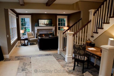 Design ideas for a mid-sized traditional open concept living room in Grand Rapids with brown walls, carpet, a standard fireplace, a brick fireplace surround and beige floor.