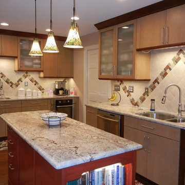 The island brings out the secondary color of the perimeter cabinets