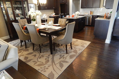 Eat-in kitchen - mid-sized contemporary dark wood floor eat-in kitchen idea in Philadelphia with dark wood cabinets and an island