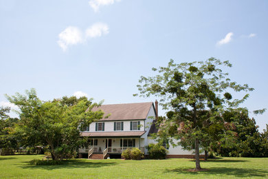 Mid-sized transitional white two-story concrete fiberboard exterior home idea in Other