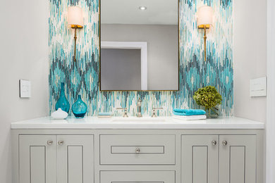 Bathroom - mid-sized transitional 3/4 multicolored tile and glass tile marble floor bathroom idea in Los Angeles with an undermount sink, flat-panel cabinets, gray cabinets, marble countertops and gray walls