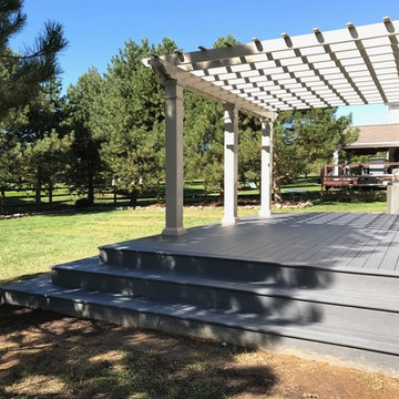 Backyard Deck With Corner-Wrapped Steps and Pergola