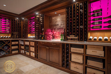 Inspiration for a large contemporary wine cellar in Boston with travertine flooring, storage racks and beige floors.