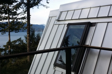 Example of a minimalist two-story exterior home design in Vancouver