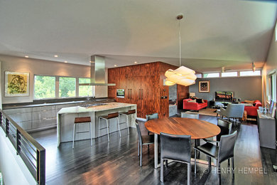 Open concept kitchen - mid-sized modern galley dark wood floor open concept kitchen idea in Minneapolis with an undermount sink, flat-panel cabinets, gray cabinets, marble countertops, white backsplash, stainless steel appliances and an island