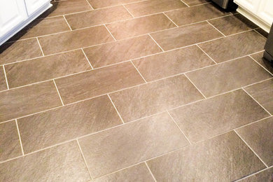 Example of a minimalist porcelain tile kitchen design in Louisville