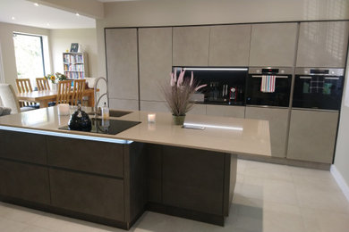 Real Cement rendered doors, handleless with Silestone in Coral Clay