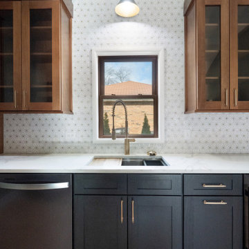 Workstation Sink with Gold Faucet and Geometric Tile Backsplash