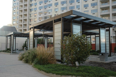 Example of a large trendy patio design in New York with a pergola
