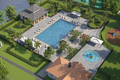 Island style pool photo in Miami