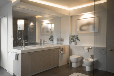 Photo of a large contemporary master bathroom in Melbourne with furniture-like cabinets, beige cabinets, a drop-in tub, a double shower, a bidet, beige tile, porcelain tile, white walls, porcelain floors, an integrated sink, solid surface benchtops, grey floor, an open shower, white benchtops, a double vanity, a built-in vanity and coffered.