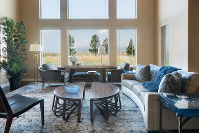 Inspiration for a large modern open concept dark wood floor family room remodel in Other with beige walls, no fireplace and a wall-mounted tv