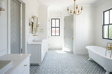 Photo of a large transitional master bathroom in Louisville with recessed-panel cabinets, white cabinets, a claw-foot tub, an open shower, a two-piece toilet, white tile, porcelain tile, white walls, cement tiles, a pedestal sink, engineered quartz benchtops, blue floor and a hinged shower door.