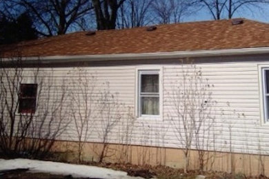 Small beige one-story vinyl gable roof photo in Cleveland