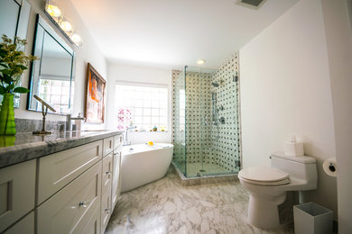 Bathroom - large transitional master marble tile, black tile and gray tile marble floor and gray floor bathroom idea in Columbus with shaker cabinets, white cabinets, a two-piece toilet, white walls, an undermount sink, marble countertops and a hinged shower door