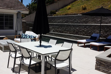 Mid-sized trendy backyard tile patio photo in San Diego with no cover