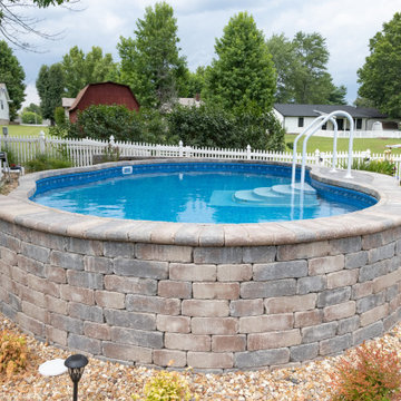 Freeform Semi-inground Stealth with stone steps and landscaping