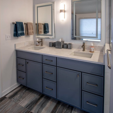 Primary Suite Remodel with Blue Cabinetry and Calacatta Miraggio Duo Quartz