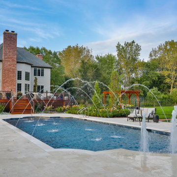 Barrington Hills, IL Scalloped Edge Pool with Round Hot Tub and Sunshelf