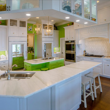 Stylish and Spacious Kitchen with Green Accents and Classic Elegance