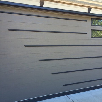 Flush Panel with Commercial windows and custom applied trim, custom painted