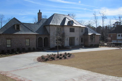 Huge elegant gray three-story mixed siding exterior home photo in Birmingham