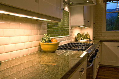 Mid-sized transitional u-shaped dark wood floor and brown floor open concept kitchen photo in Salt Lake City with a double-bowl sink, recessed-panel cabinets, white cabinets, quartz countertops, white backsplash, porcelain backsplash, stainless steel appliances and an island