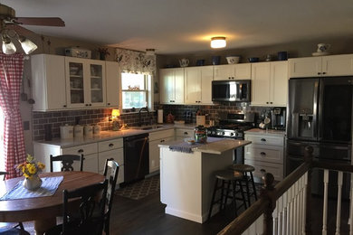 This is an example of a mid-sized country kitchen in St Louis.