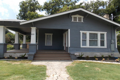Example of a mid-sized classic blue one-story wood exterior home design in Other