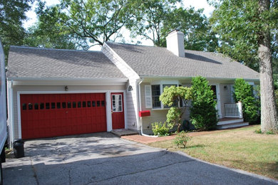 Inspiration for a mid-sized timeless beige two-story wood exterior home remodel in Providence