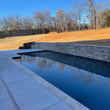 Custom pool with elevated back wall and LED Waterfalls