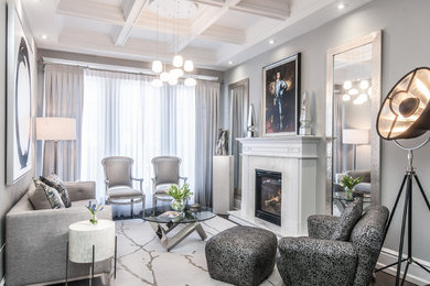 Example of a mid-sized transitional formal dark wood floor and brown floor living room design in Toronto with gray walls, a standard fireplace, a stone fireplace and no tv