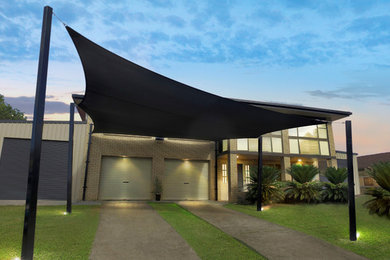 Design ideas for a large modern attached two-car carport in Brisbane.