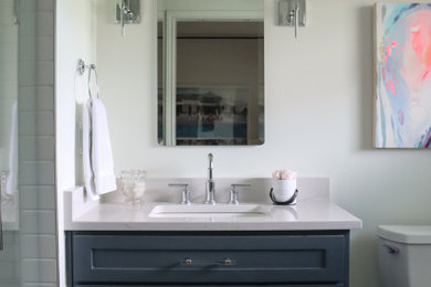 Example of a transitional master white tile and ceramic tile marble floor, white floor and single-sink bathroom design in Other with shaker cabinets, blue cabinets, white walls, quartz countertops, yellow countertops and a built-in vanity
