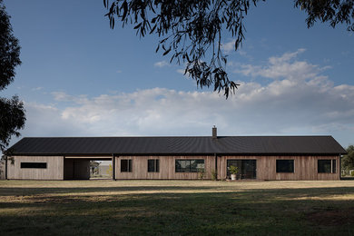 Inspiration for a contemporary one-storey grey exterior in Geelong with wood siding.