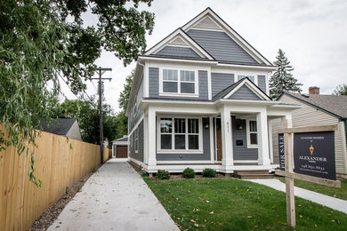 Example of an arts and crafts exterior home design in Detroit