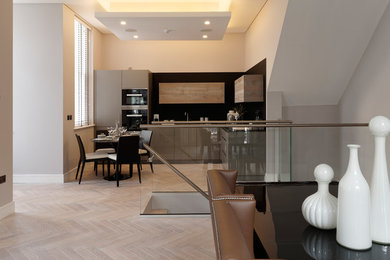 Design ideas for a medium sized contemporary living room in London with grey floors.