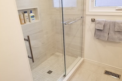 Example of a large transitional 3/4 porcelain tile and beige floor bathroom design in Toronto with flat-panel cabinets, medium tone wood cabinets, white walls, an undermount sink and beige countertops
