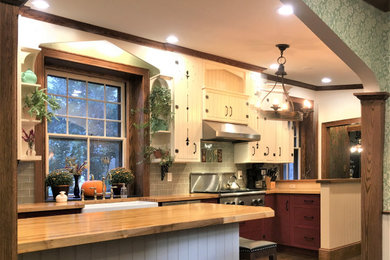 Large ornate l-shaped medium tone wood floor and brown floor open concept kitchen photo in Philadelphia with a farmhouse sink, beaded inset cabinets, white cabinets, wood countertops, green backsplash, porcelain backsplash, stainless steel appliances, two islands and brown countertops