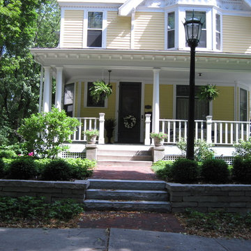 The front entrance walk of brick with stone steps
