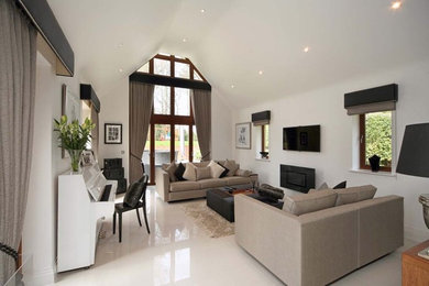 Design ideas for a large contemporary open concept living room in London with white walls and white floor.